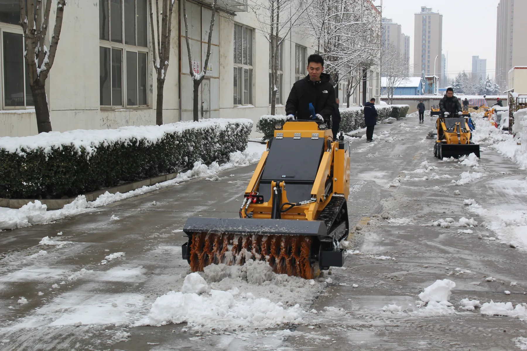 BL-T750-H with an angle broom sweeper clearing snow